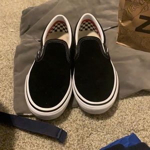 Black and white slip on vans